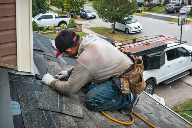 Professional Storm Damage Roof Repair technician working in Buchanan, NY